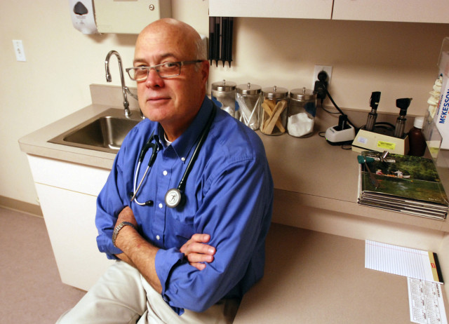 Democratic incumbent Dr. Alan Bates sits in his family practice in Medford Oregon