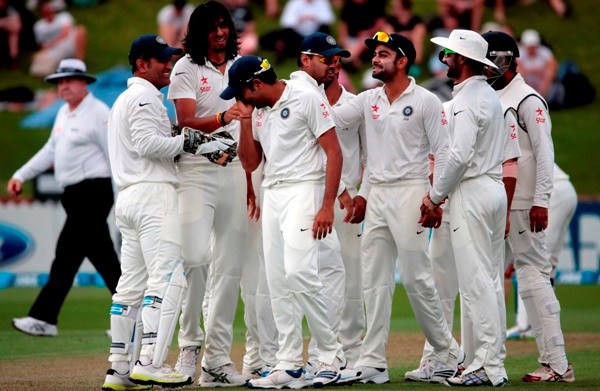 India's players celebrates the dismissal of New Zealan's Peter Fulton during day one of the second international test cricket match at the Basin Reserve in Wellington