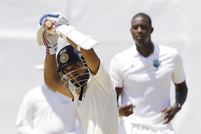 Indian batsman Ajinkya Rahane lets a deliver from West Indies captain Jason Holder pass during day three of their second cricket Test match at the Sabina Park Cricket Ground in Kingston Jamaica Monday Aug. 1