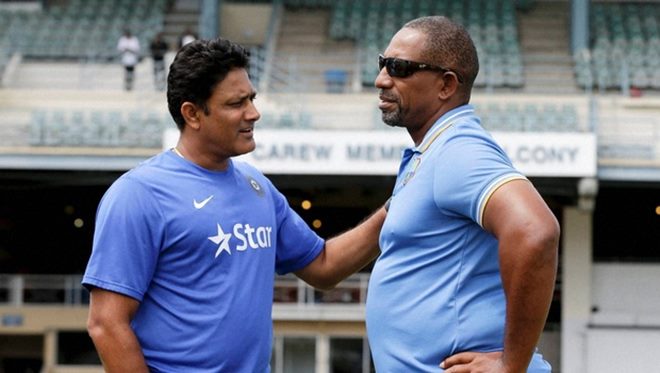 India's cricket team head coach Anil Kumble left and West Indies coach Phil Simmons talk after touring the field of play at Queen's Park Oval in Port-of Spain Trinidad on Sunday