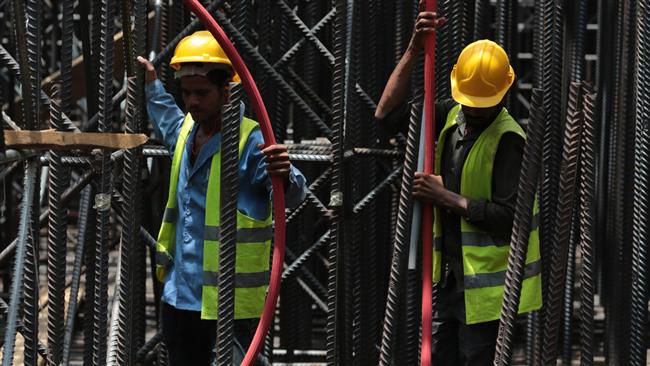 2014 men do foundation work at the construction site of Kingdom Tower a planned 252-story building in Jeddah Saudi Arabia