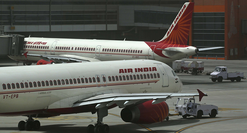 Air India planes are parked on the tarmac at the Terminal 3 of Indira Gandhi International Airport in New Delhi India Friday