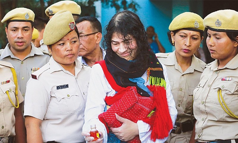 IMPHAL Irom Sharmila picks up a bottle of honey to break her fast on Tuesday. She ended a 16-year hunger strike licking honey from her hand and declaring “I will never forget this moment.” Sharmila had been force-fed through a tube in her nose and