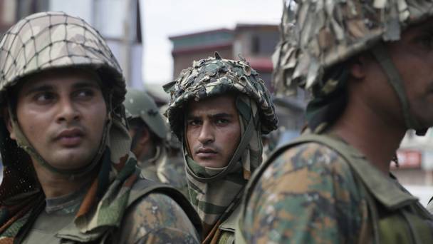 Indian paramilitary soldiers on guard near the site of a gun battle in Srinagar in India-controlled Kashmir