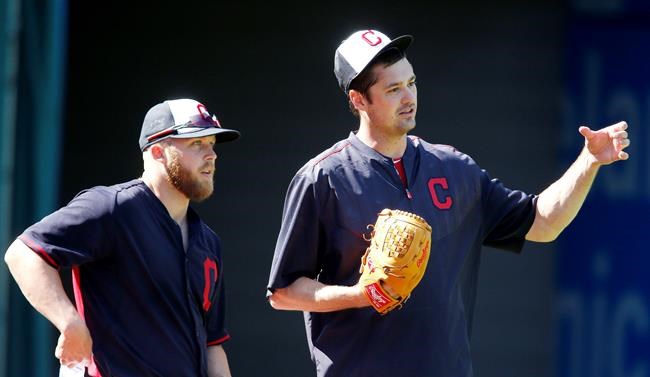 Cleveland Indians relief pitcher Andrew Miller right talks with relief pitcher Cody Allen during batting practice before a baseball game against the Minnesota Twins Monday Aug. 1 2016 in Cleveland