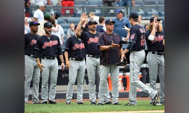 Cleveland Indians relief pitcher Andrew Miller is congratulated by manager Terry Francona third from right and teammates after the Indians beat the New York Yankees 5-2 in a baseball game Saturday Aug. 6 2016 in New York. (AP