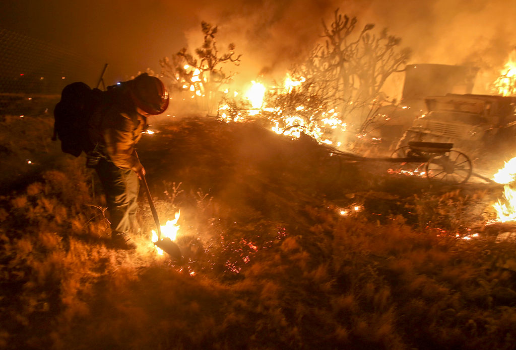 A rapidly spreading fire raging east of Los Angeles forced the evacuation of more than 82,000 people on August 16 as the governor of Cali