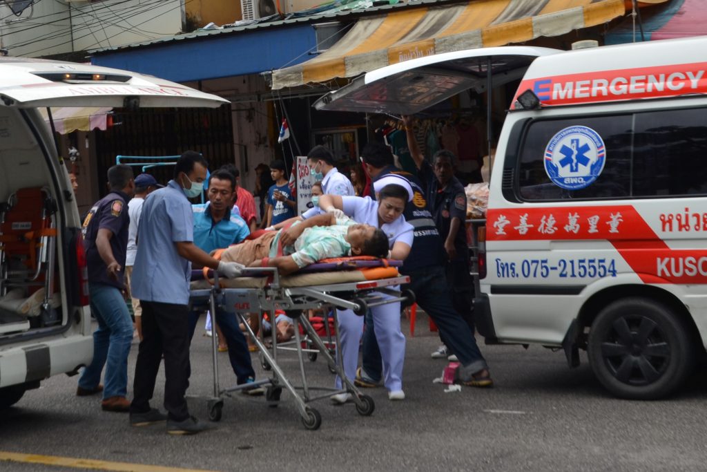 Injured people receive first aid after a bomb exploded on Aug. 11 in Trang Thailand