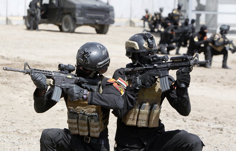 Members of Iraqi counter-terrorism forces take part in training under the command of international military instructors in Baghdad