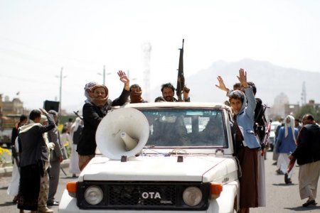 Armed men loyal to the Houthi movement ride on a vehicle during a protest against the Saudi-backed exiled government deciding to cut off the Yemeni central bank from the outside world in the capital Sanaa Yemen