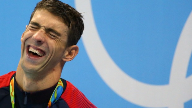 Michael Phelps cracks up during the ceremony for his 20th gold medal