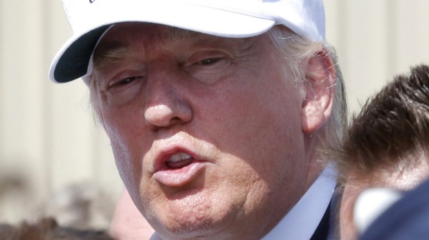 Republican presidential nominee Donald Trump speaks with flood victims in Louisiana