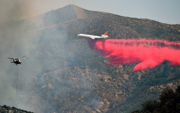 JOSH EDELSON						Credit AP				An air tanker drops fire retardant Monday at a containment line northeast of Lower Lake Calif