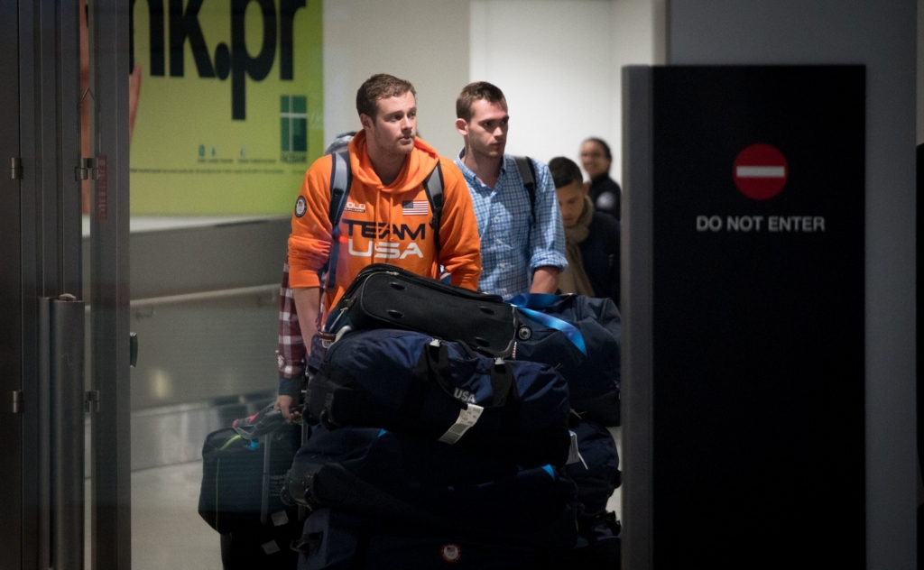 MIAMI FL- AUGUST 19 USA National Swimming Team members Jack Conger and Gunnar Bentz are escorted through the International terminal at Miami International Airport upon their arrival to the United States from Rio de Janeiro Brazil