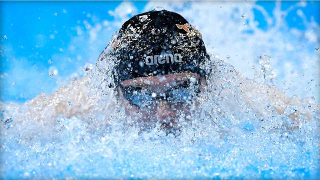 Jack Conger swims in the men’s 100-meter butterfly preliminaries at the U.S. Olympic swimming trials