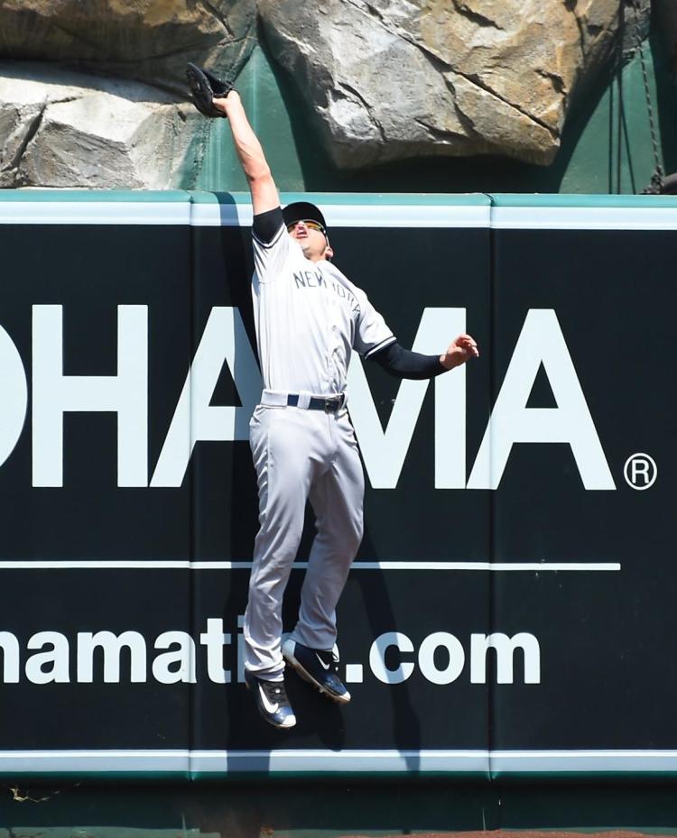 Jacoby Ellsbury gets some air to rob Albert Pujols