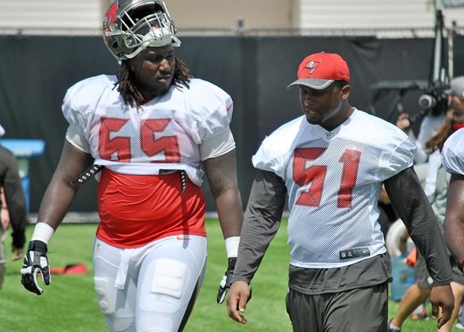 Tampa Bay Buccaneers linebacker Daryl Smith talks with teammate tackle Taylor Fallin during a combined NFL football practice between the Buccaneers and the Jacksonville Jaguars Wednesday Aug. 17 2016 in Jacksonville Fla. (AP