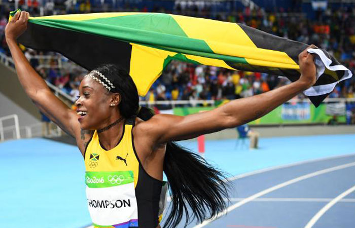 Jamaica’s Elaine Thompson celebrates after winning the 100m final at the Rio 2016 Games Saturday. — AFP