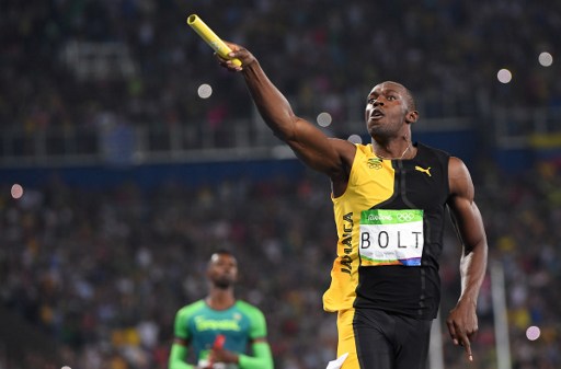 Jamaica's Usain Bolt celebrates after Team Jamaica won the Men's 4x100m Relay Final during the athletics event at the Rio 2016 Olympic Games