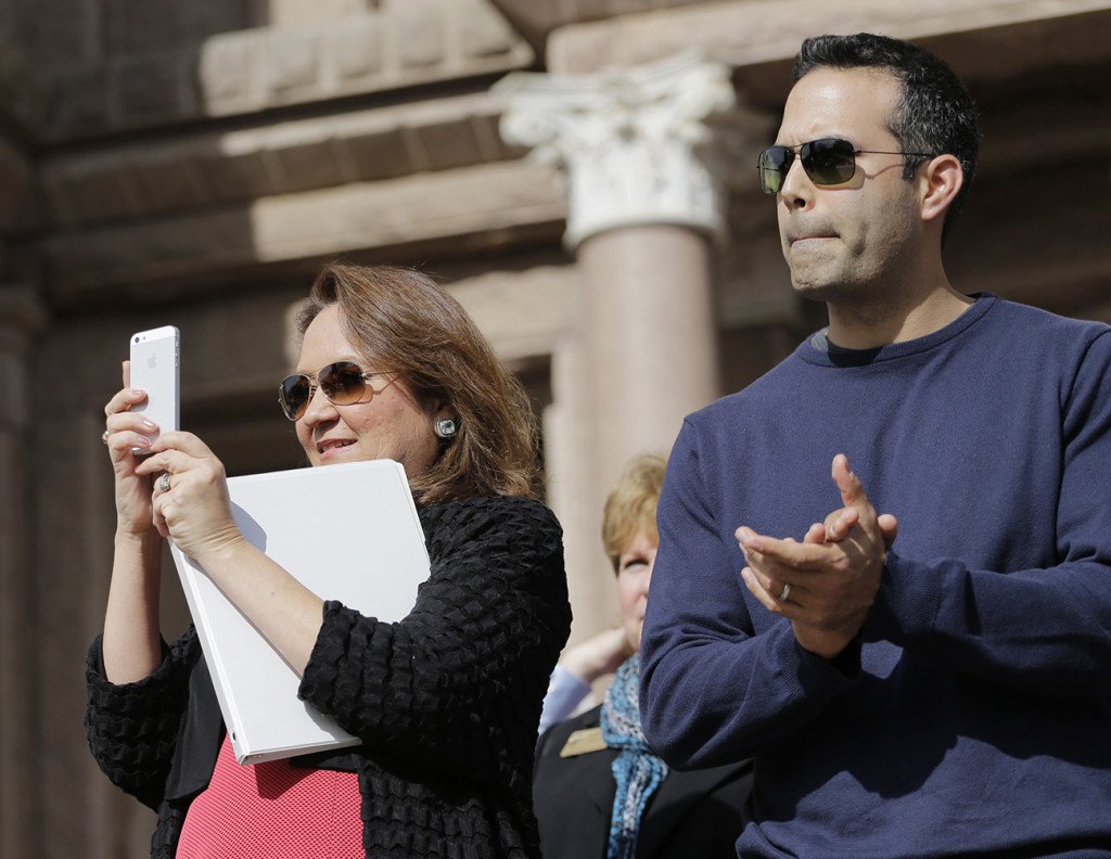 Cecelia Abbott wife of Texas Gov. Greg Abbott left and George P. Bush take part in the Texas Rally for Life in this 2015 file