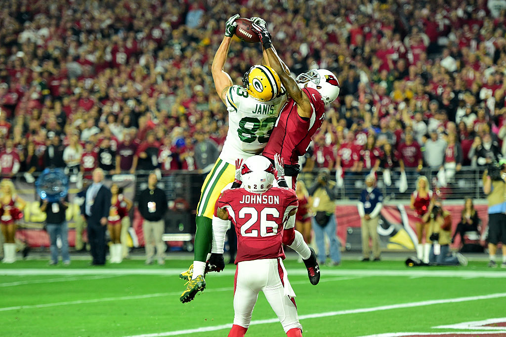 GLENDALE AZ- JANUARY 16 Wide receiver Jeff Janis #83 of the Green Bay Packers catches a 41-yard touchdown on the final play of regulation against cornerback Patrick Peterson #21 of the Arizona Cardinals in the NFC Divisional Playoff Game at University