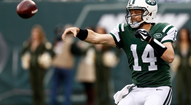 EAST RUTHERFORD NJ- DECEMBER 27 Ryan Fitzpatrick #14 of the New York Jets throws a pass in the third quarter against the New England Patriots during their game at Met Life Stadium