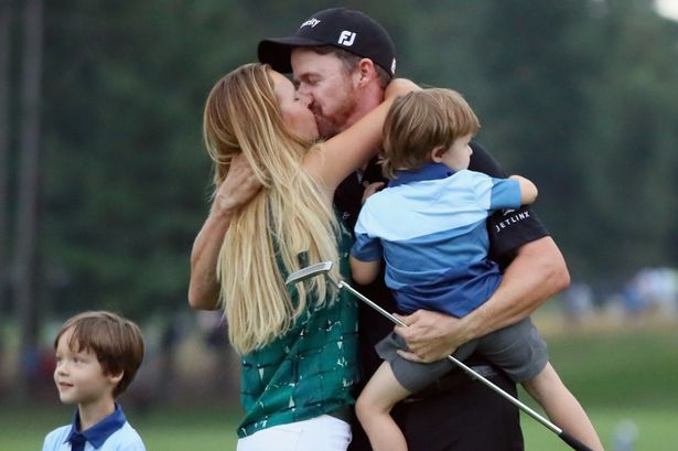 Jimmy Walker embraces wife Erin and his son Beckett after winning his first Major