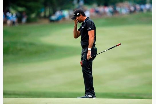 Jason Day reacts after missing a birdie putt on the 14th hole during the final round of the PGA Championship golf tournament at Baltusrol Golf Club in Springfield N.J. Sunday