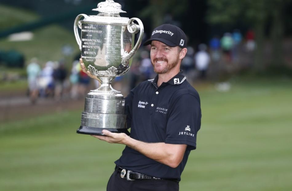 Jimmy Walker with the trophy after winning the PGA Championship