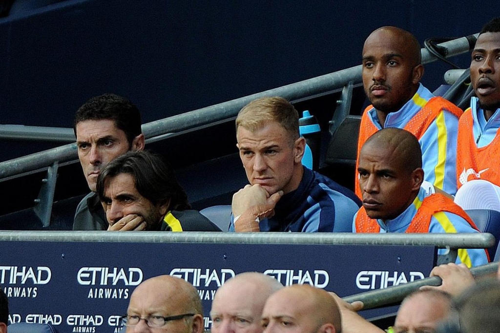 Joe Hart looks on from the bench