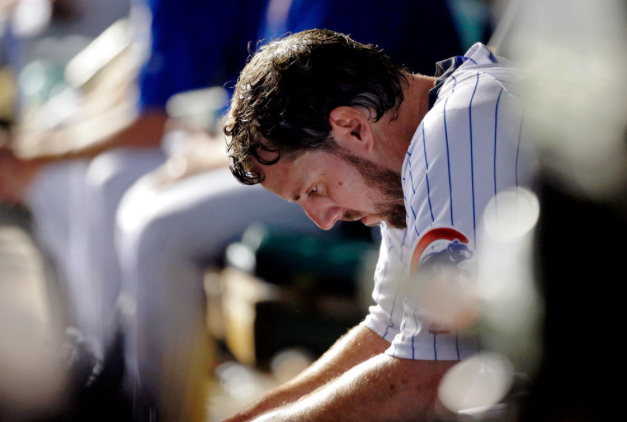 John Lackey in the dugout after leaving Sunday's start with shoulder soreness