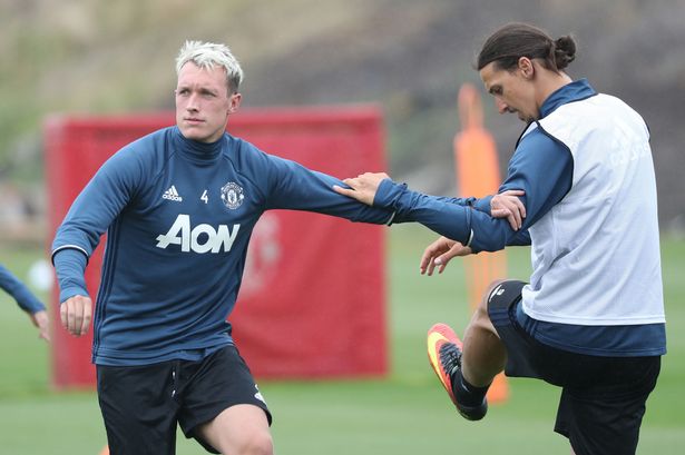 Phil Jones and Zlatan Ibrahimovic of Manchester United in action during a first team training session at Aon Training Complex