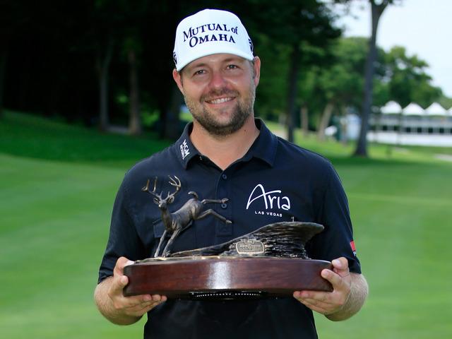 Ryan Moore with the John Deere Classic trophy