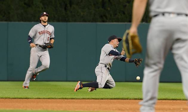 Houston Astros second baseman Jose Altuve back right drops a popup off the bat of Detroit Tigers&#039 Miguel Cabrera in the sixth inning of a baseball game in Detroit Saturday