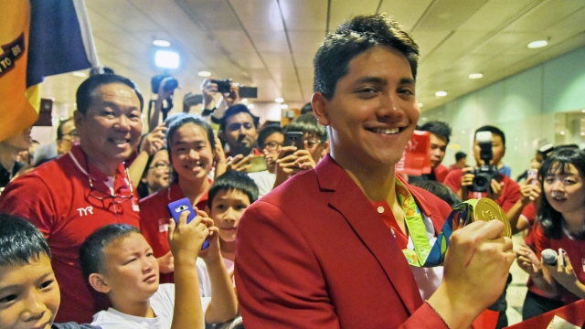 Joseph Schooling gets hero's welcome selfie with PM and exemption from compulsory military service