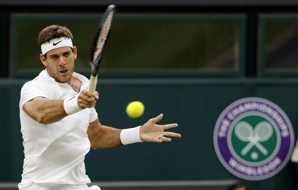 Juan Martin del Potro of Argentina returns to Stan Wawrinka of Switzerland during their men's singles match on day five of the Wimbledon Tennis Championships in London. |AP