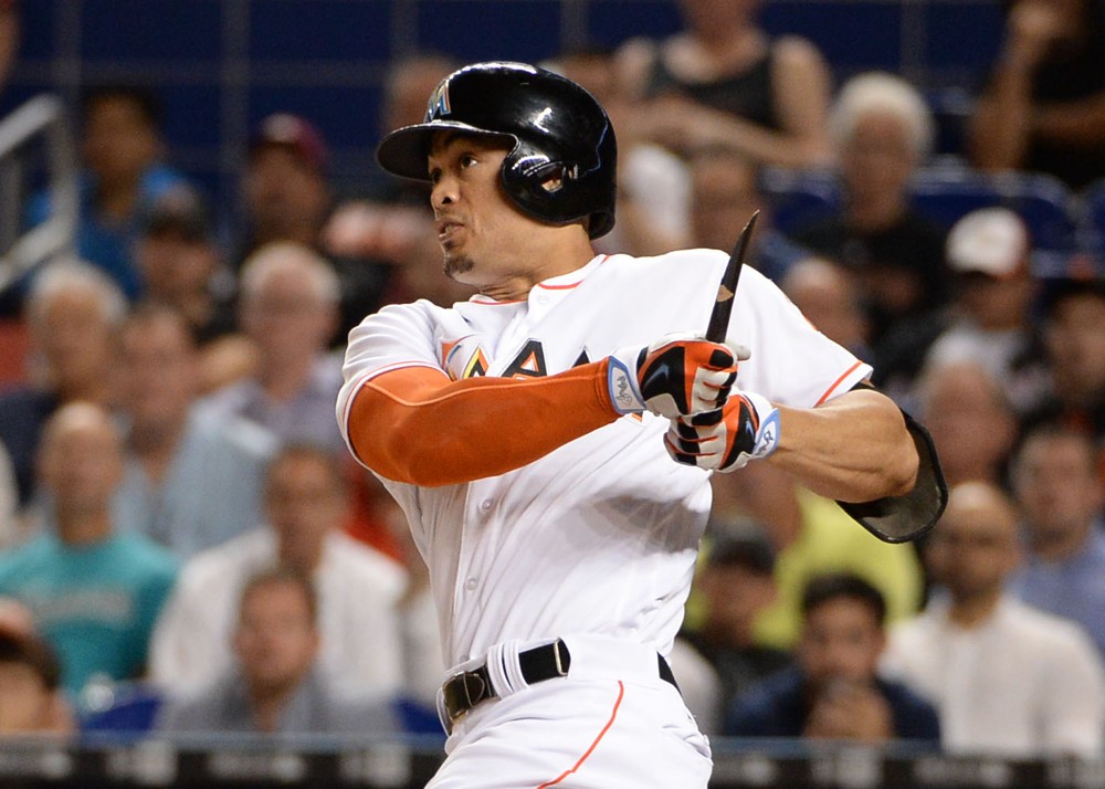 Miami Marlins right fielder Giancarlo Stanton with a powerful swing brakes his bat on a double with RBI during a game between the Miami Marlins and the San Francisco Giants at Marlins Park in Miami FL