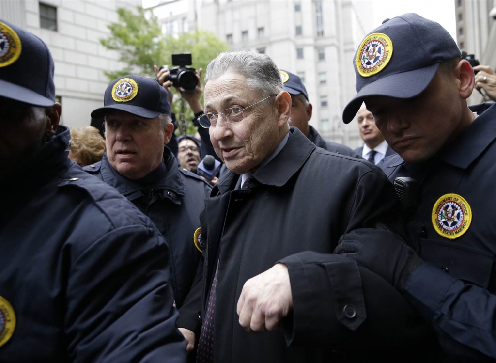 Image Former Assembly Speaker Sheldon Silver leaves court surrounded by reporters