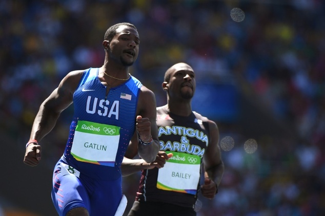 Justin Gatlin and Antigua's Daniel Bailey compete in the men's 100m round 1 in Rio