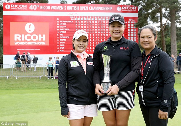 Jutanugarn is joined by her sister Moriya and her mother Narumon after her three shot victory