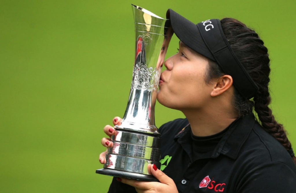 Ariya Jutanugarn the LPGA's first Thai-born major champion gets cozy with the Women's British Open trophy