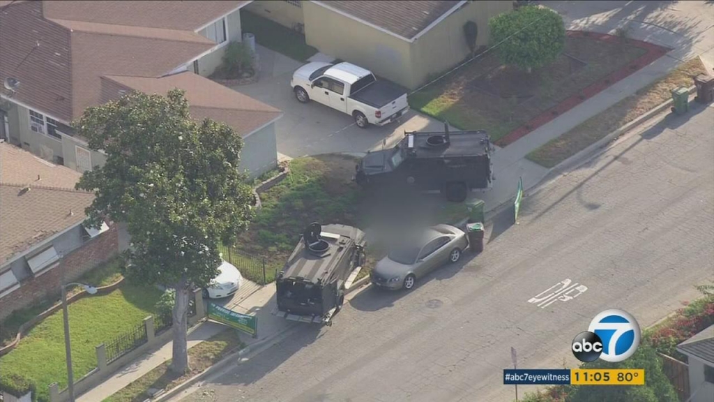 SWAT vehicles are shown in a Compton neighborhood where a man was fatally shot by sheriffs deputies on Thursday