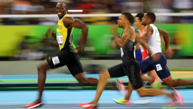 Usain Bolt races in the 100m semifinals before going on to win his third successive 100m Olympic gold