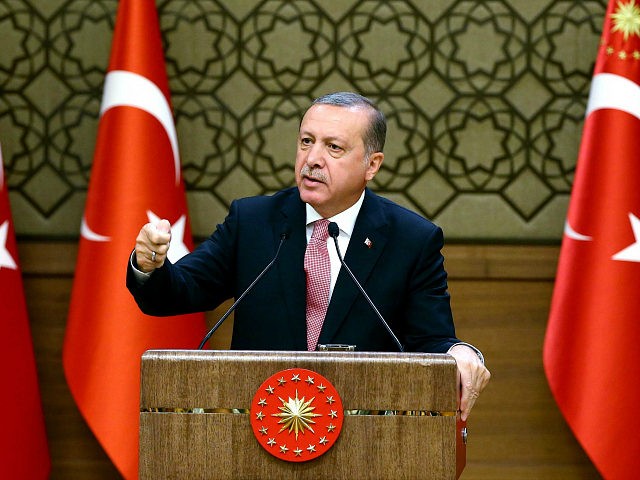 Turkish President Recep Tayyip Erdogan delivers a speech during an economic meeting with international investors at the Presidential Complex in Ankara