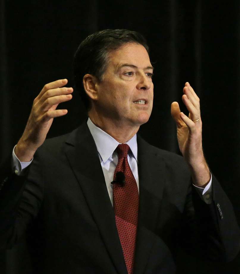 FBI Director James Comey gestures during an address to the American Bar Association annual meeting Friday Aug. 5 2016 in San Francisco