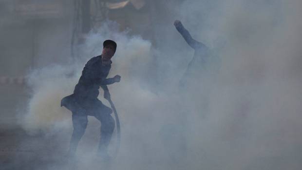 Kashmiri Muslim protesters throw rocks at Indian paramilitary soldiers in Srinagar Indian-controlled Kashmir