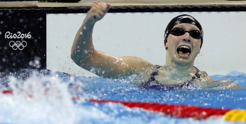 Katie Ledecky celebrates winning the gold medal in the 400-meter freestyle and setting a new world record on Sunday. | Lee Jin-man  AP