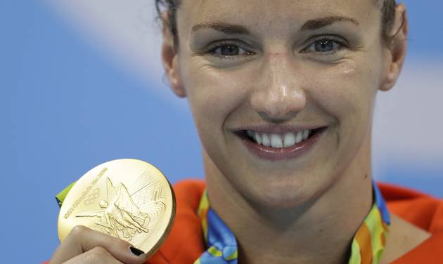 Hungary's Katinka Hosszu shows off her gold medal for the women's 200-meter individual medley final during the swimming competitions at the 2016 Summer Olympics Wednesday Aug. 10 2016 in Rio de Janeiro Brazil