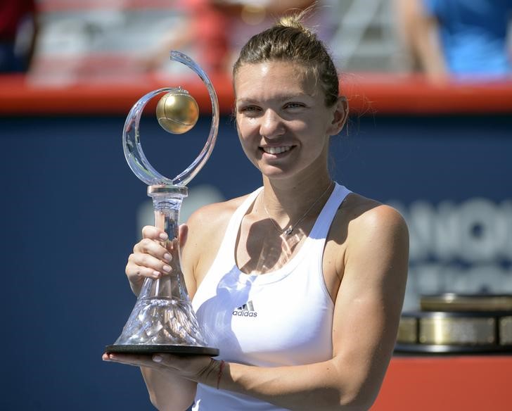 Jul 31 2016 Montreal Quebec Canada Simona Halep of Romania with the champions trophy after defeating Madison Keys of the United States during the final of the Rogers Cup tennis tournament at Uniprix Stadium. Eric Bolte-USA TODAY Sports