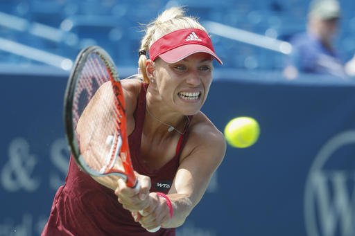 Angelique Kerber of Germany returns to Carla Suarez Navarro of Spain during the quarterfinals of the Western & Southern Open tennis tournament Friday Aug. 19 2016 in Mason Ohio